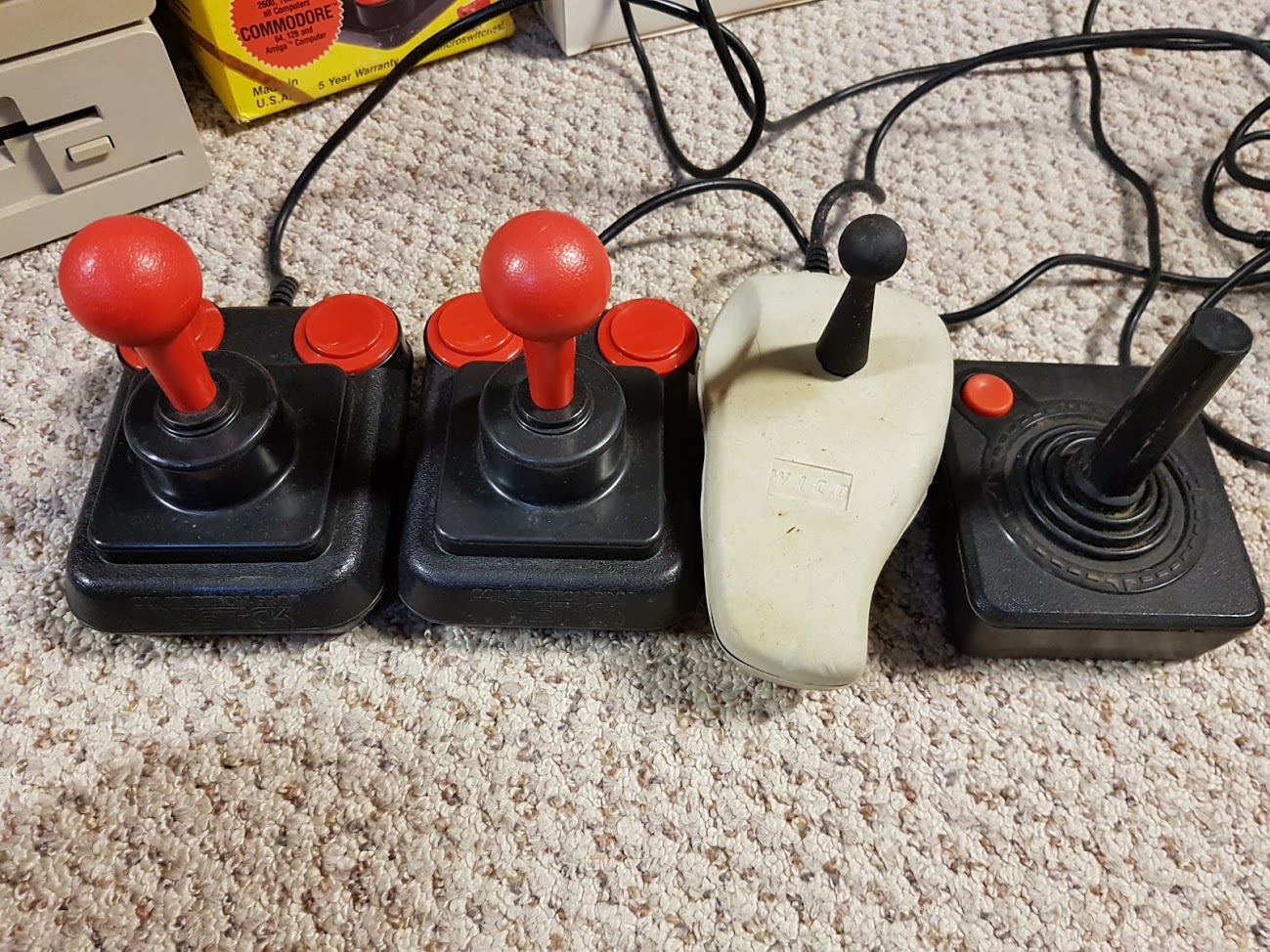 "These were just lose inside the box. I had the second from the right joystick here -- and it sucked. Cramped up my hand after playing for a little while."