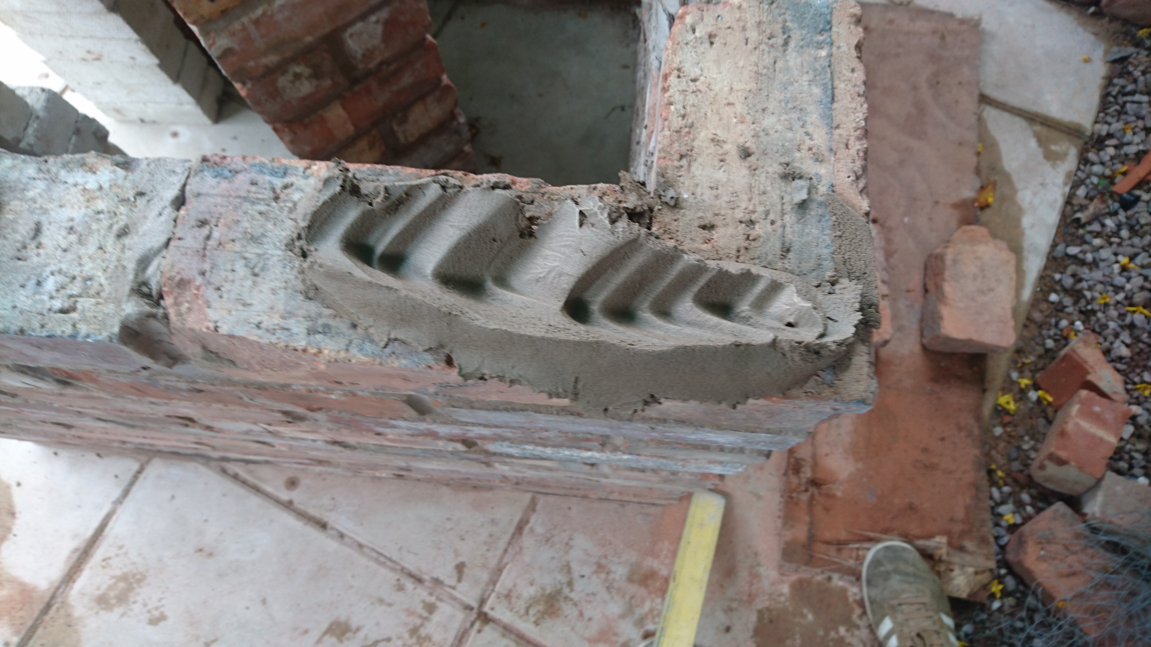 "Next, start laying. Create grooves in the mortar to make good adhesion to the brick. I told you I wasn't a pro but everyone has to start somewhere!"