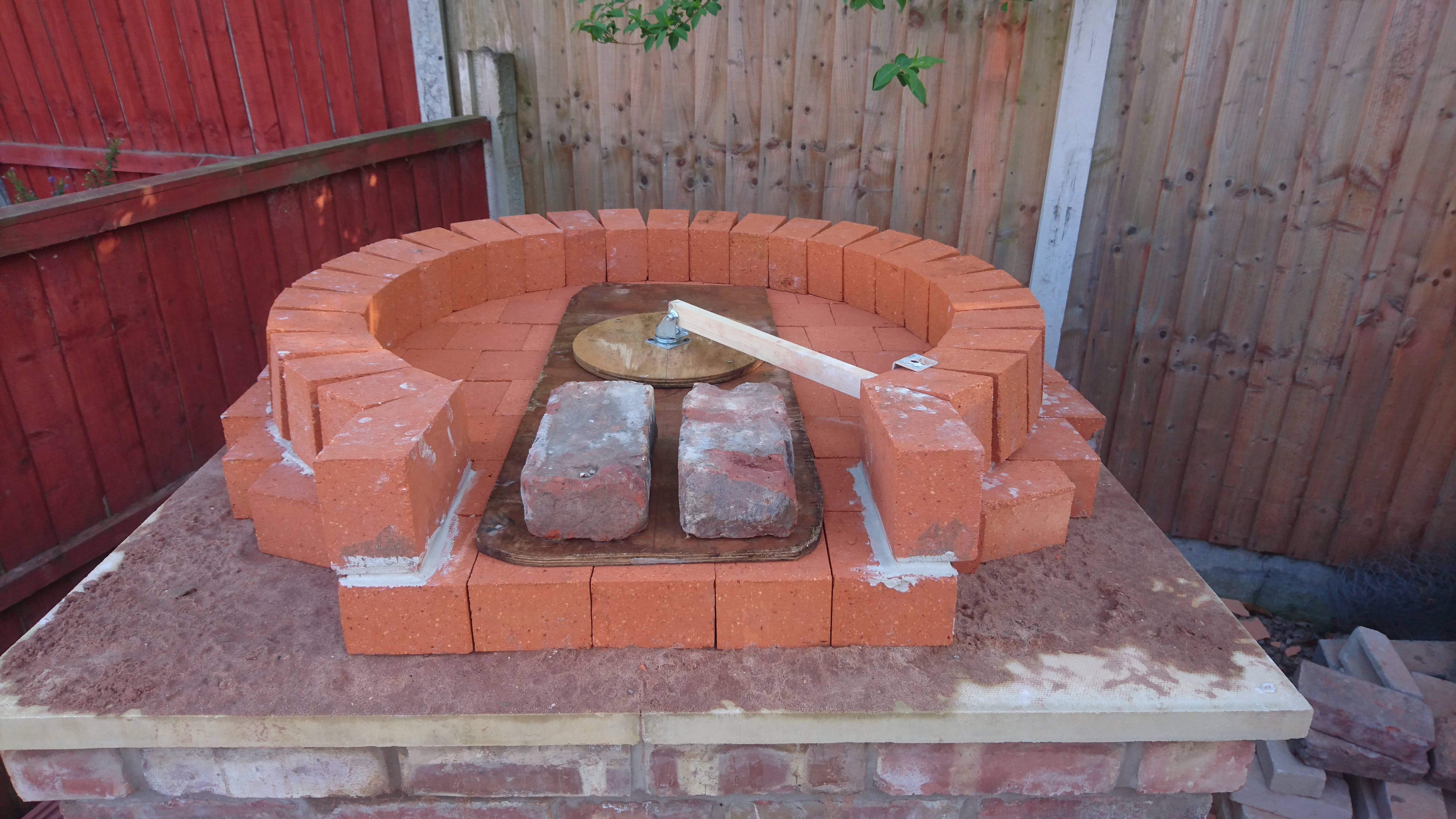 Now a whole brick cut to meet the angle and create the opening.