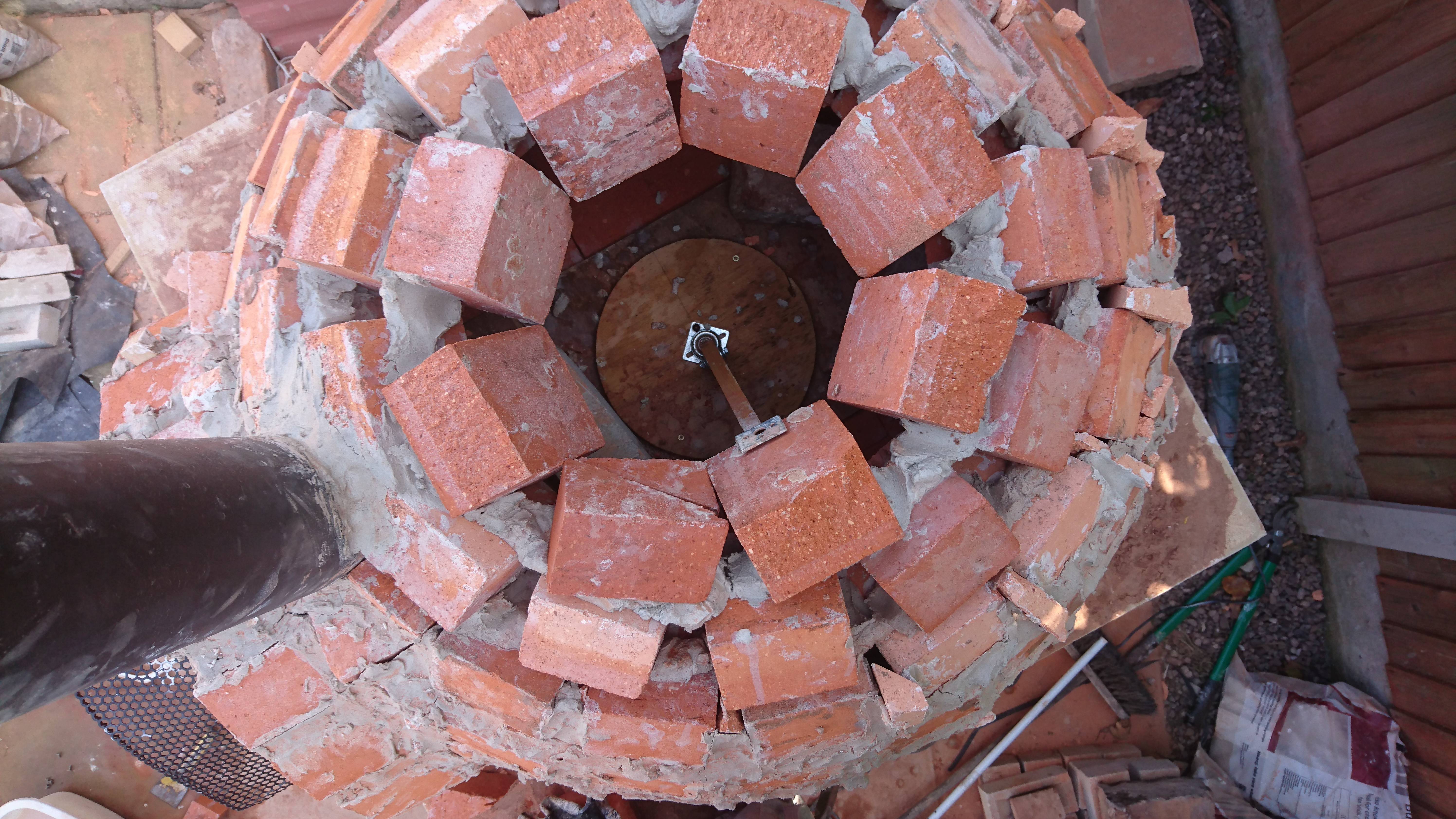 Almost vertical. "These last few bricks weren't soaked in water to help them suck into the cement."