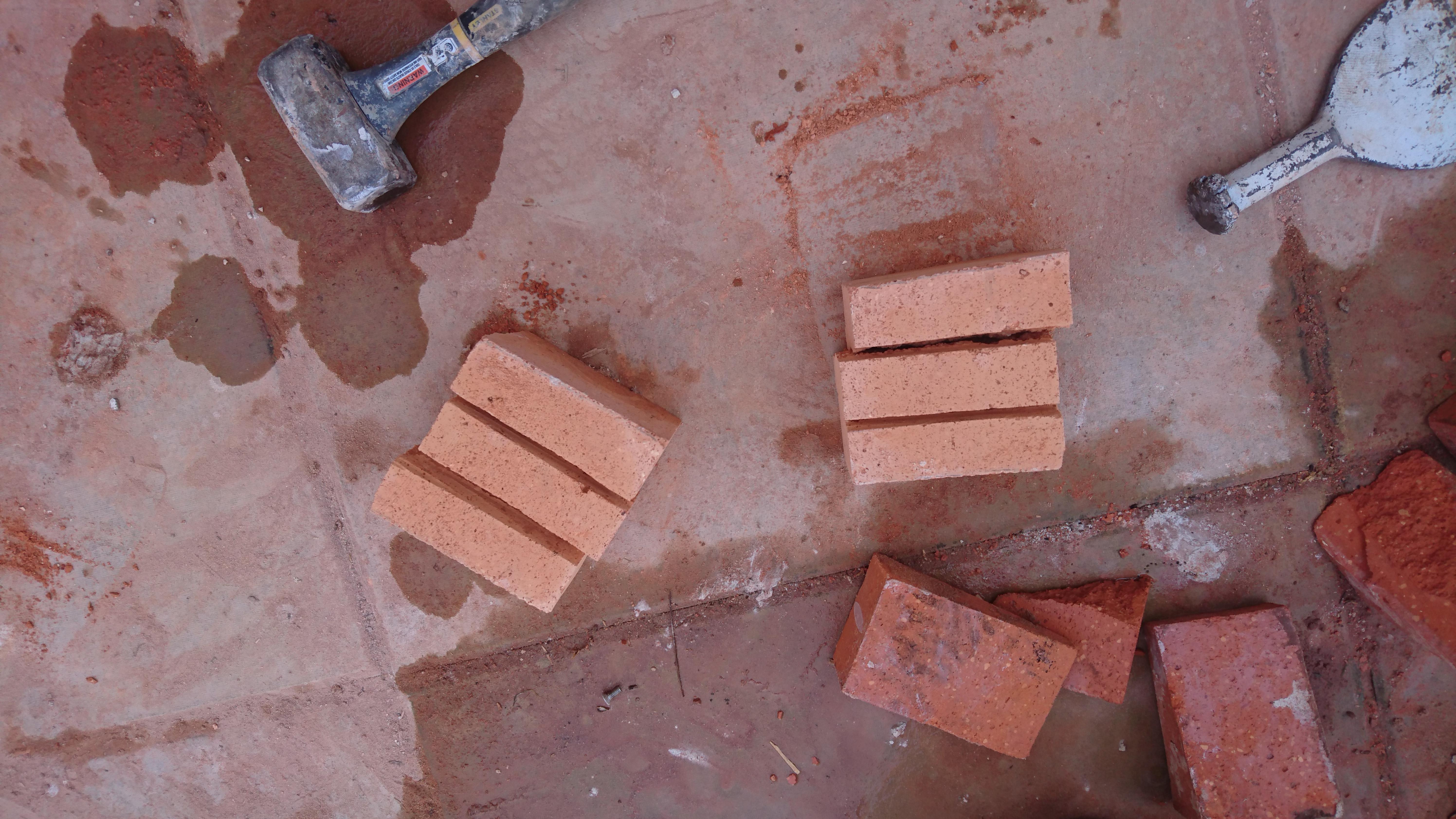 "Now for the last few pieces, these half bricks have been split into less weighty "fingers" for the top."