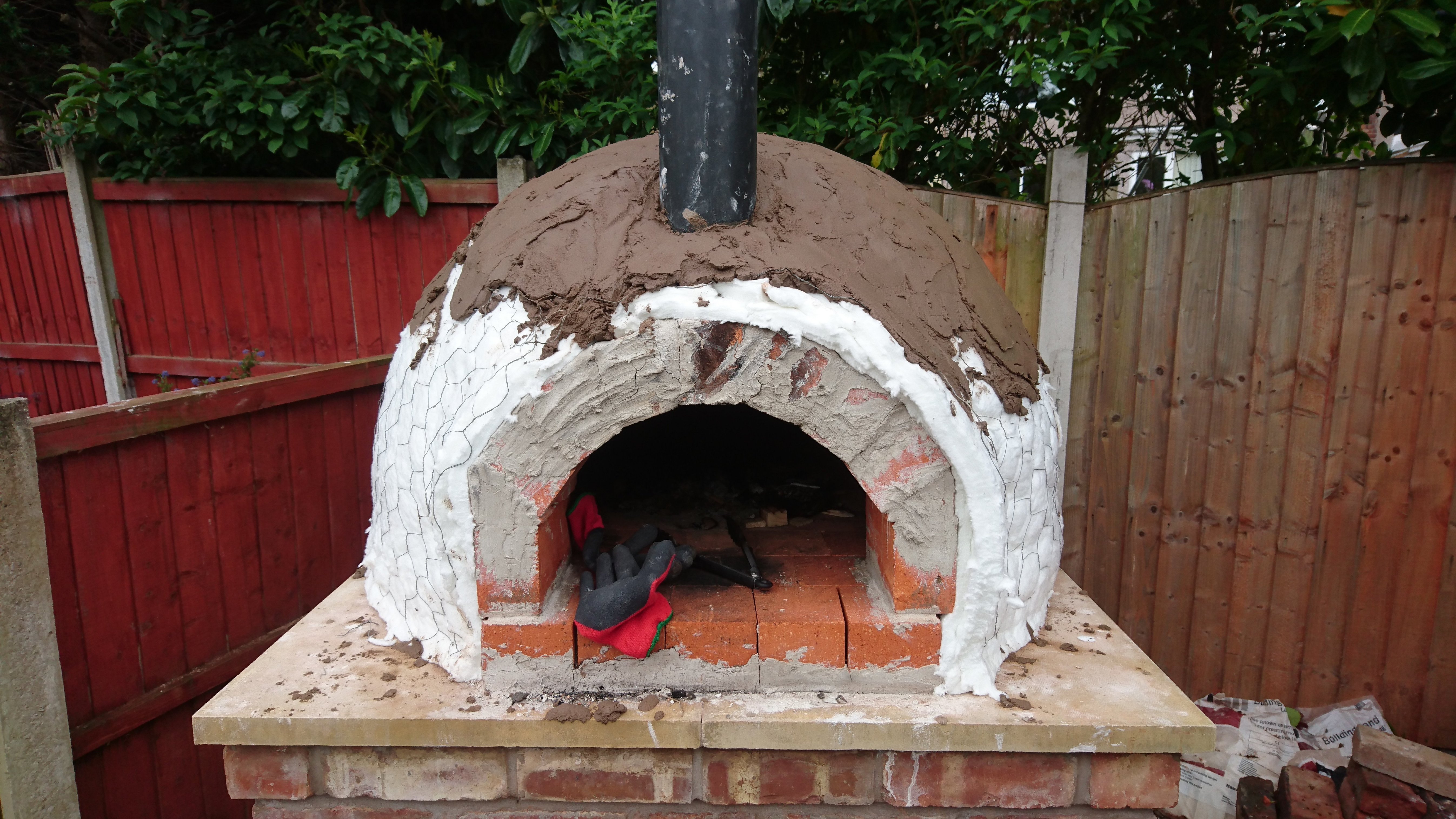 "Now I covered the whole thing in a concrete shell. This was a strong mix of 4/1. I used the small trowel to "smush" the mix into the walls, as it gets quite tricky on the nearly vertical sides on the dome."