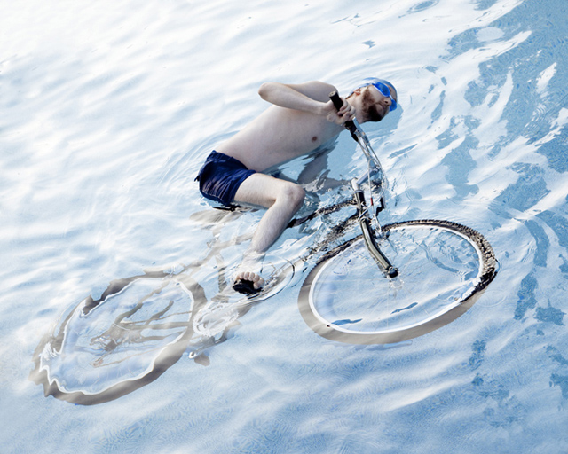 Man on a bike in a swimming pool