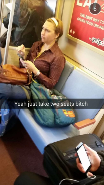 Snapchat of a woman who is taking up two seats on the subway.