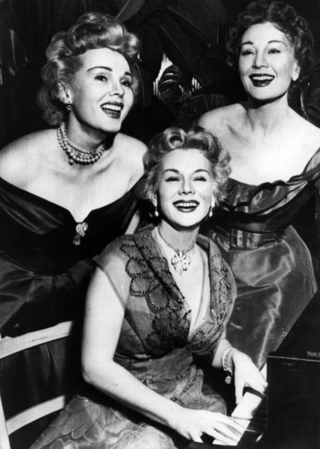 Zsa Zsa, Eva and Magda Gabor at an event in 1953. Eva, despite being the youngest, broke into Hollywood first in the early 1940s, and had established herself for nearly 10 years before Zsa Zsa started her career. Magda did not get into acting, but instead became a Hollywood socialite. The sisters, all from Hungary, intermingled with high society routinely, and rumors of their affairs and party girl ways is legendary.