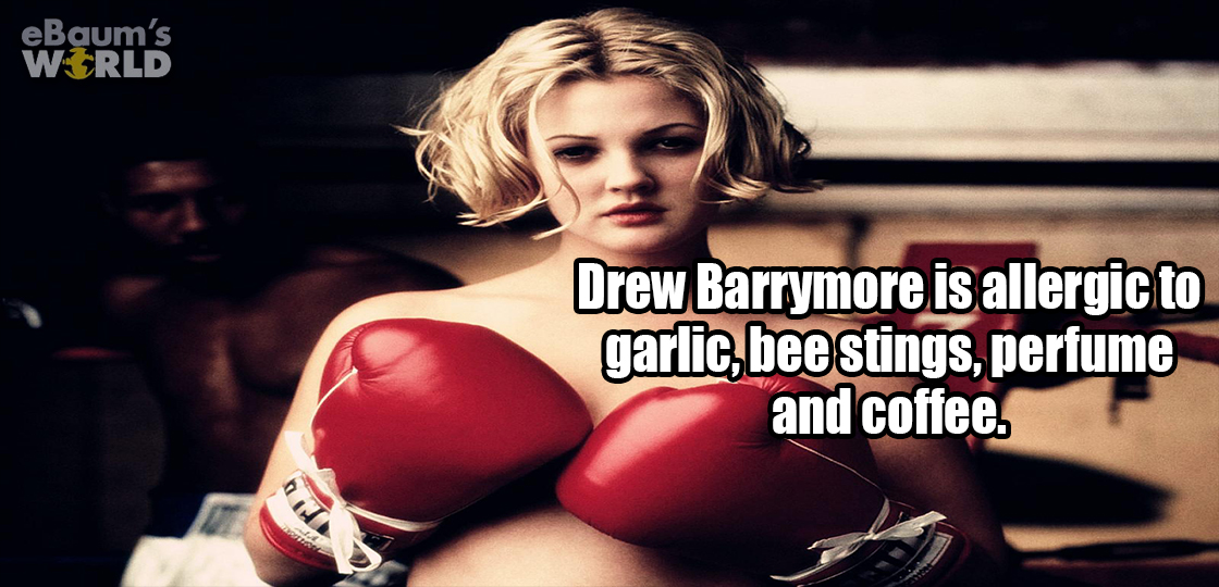 Drew Barrymore wearing boxing gloves with fun fact about how she is allergic to a bunch of things such as garlic, bee stings, perfume and coffee.