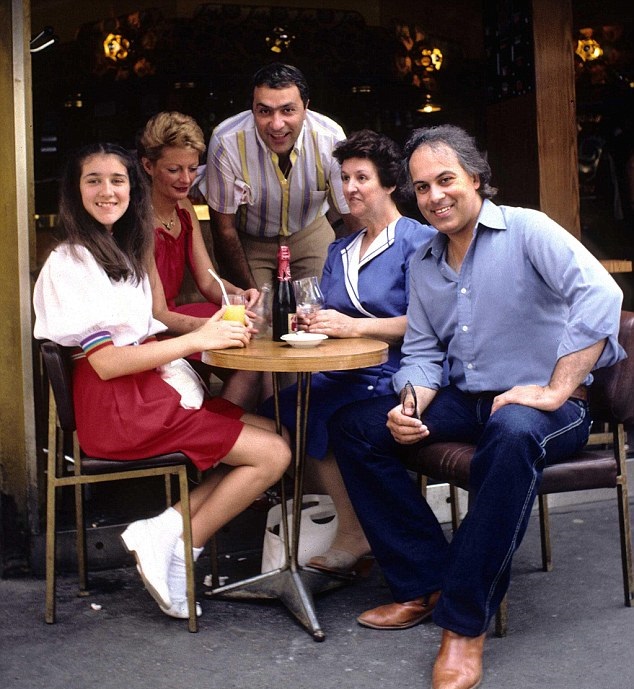 14 Year old Céline Dion (left) with some of her family and her 40 year old mentor/manager René Angelil (right) in 1982. Céline met René 2 years prior, and he declared her a star and became her mentor/manager.