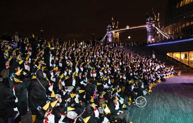 Largest Gathering Of People Dressed As Penguins. As you can probably guess, from the sight of the London Bridge in the background, behind the penguins, this silly record was set in London at Canary Wharf. The 624 people that dressed as penguins from head to toe showed up at The Scoop, an amphitheater located underneath the City Hall on the south side of the River Thames. The record-breaking gathering was organized by the Richard House Children’s Hospice as a fundraising event. In the end, it was proven to be worth it as it raised over $25,000 for children with life-threatening health conditions and their families.