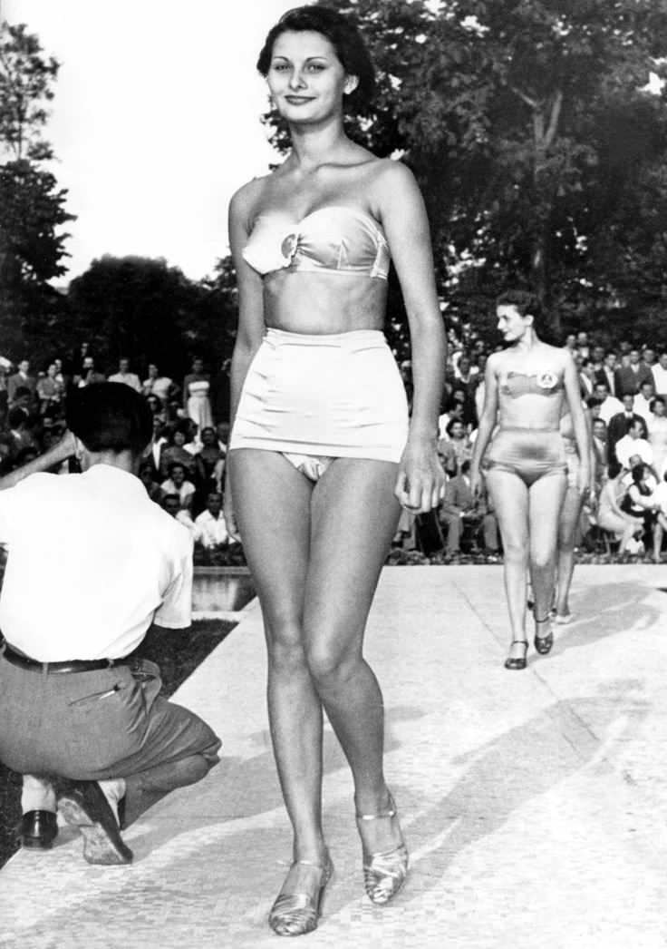 Sofia Loren (real name Sofia Villani Scicolone) in the Miss Italy Pageant in 1950. She was credited as being 14 when she entered, but that is incorrect as she is in fact 16. The stunning Italian actress was a finalist, but did not win. She used this exposure to enroll in acting classes and soon started her very successful career. An interesting note from her childhood, but when she was growing up in Italy during WWII, she actually took shrapnel from a bombing raid, and suffered injuries to her torso and chin. She also went to jail for 18 days in 1982 in Italy for tax evasion. She also is the first best actress winner to do so in a foreign film. She has been married twice, and has 2 children.