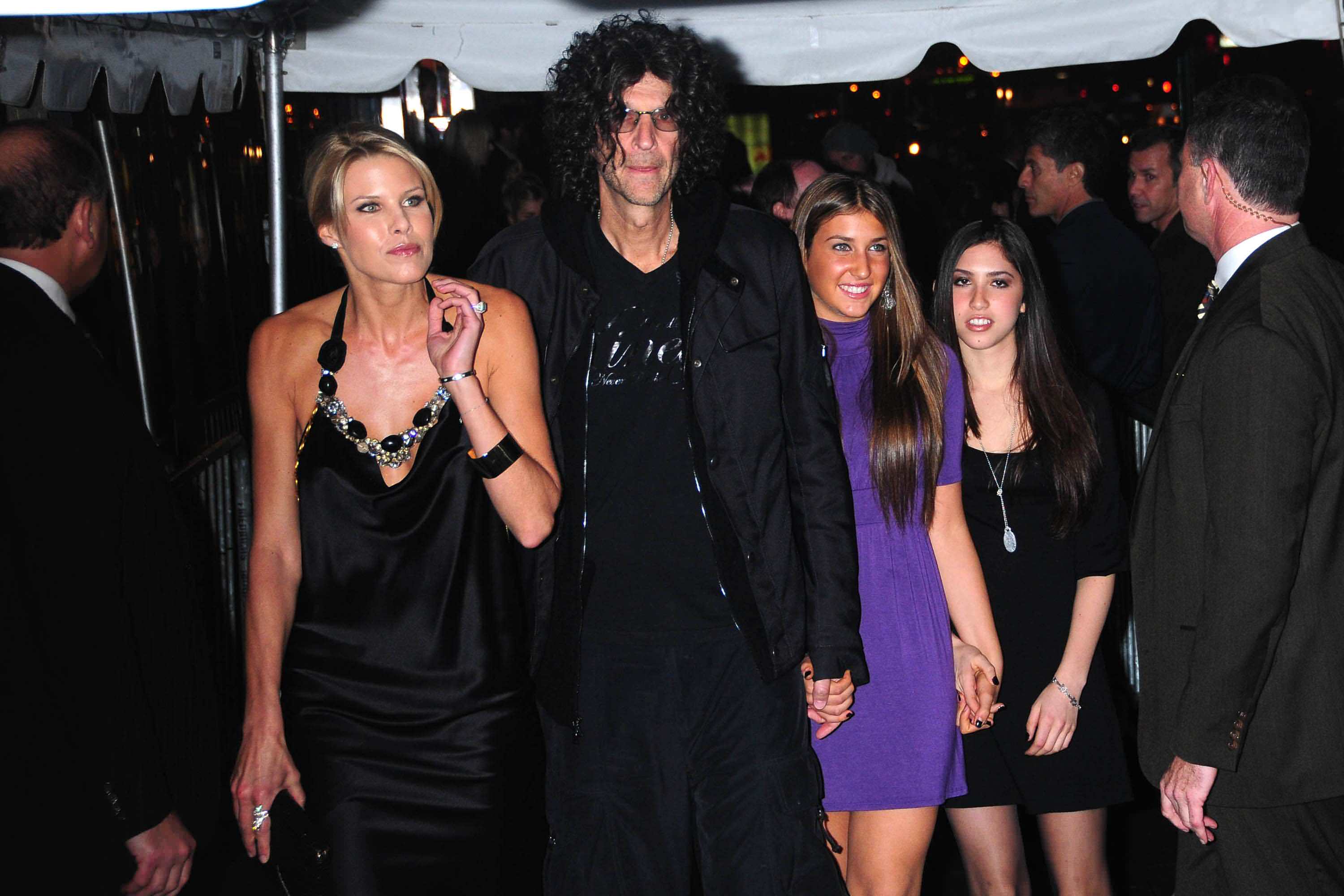 Howard Stern attends a film premier with his wife Beth Ostrosky (left) and his daughters Ashley (second from right) and Debra (far right) from his first marriage. Beth is only 11 years older than his eldest daughter Emily (not pictured). The famous disc jockey is worth a ridiculous $600 million.