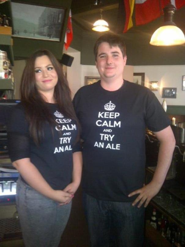 Couple wearing shirts that say keep calm and try an ale and the girls shirt is creased to read Try Anal.