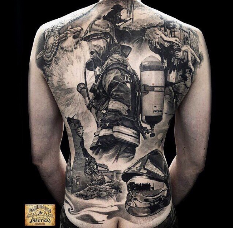 elaborate black and white tattoo of a fire fighter on a woman's back.