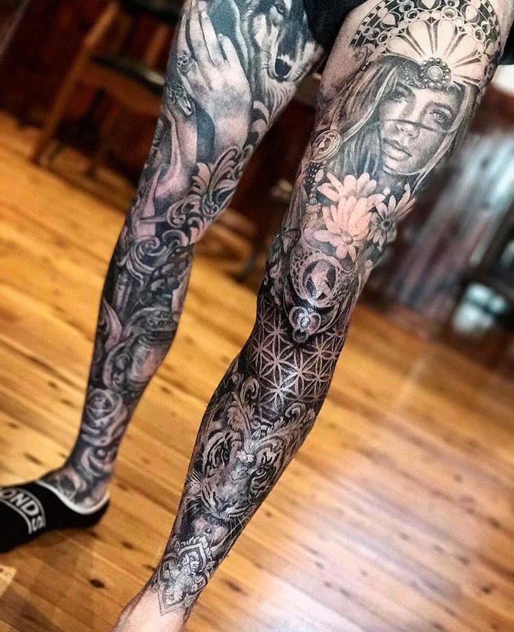 Very elaborate leg tattoos.