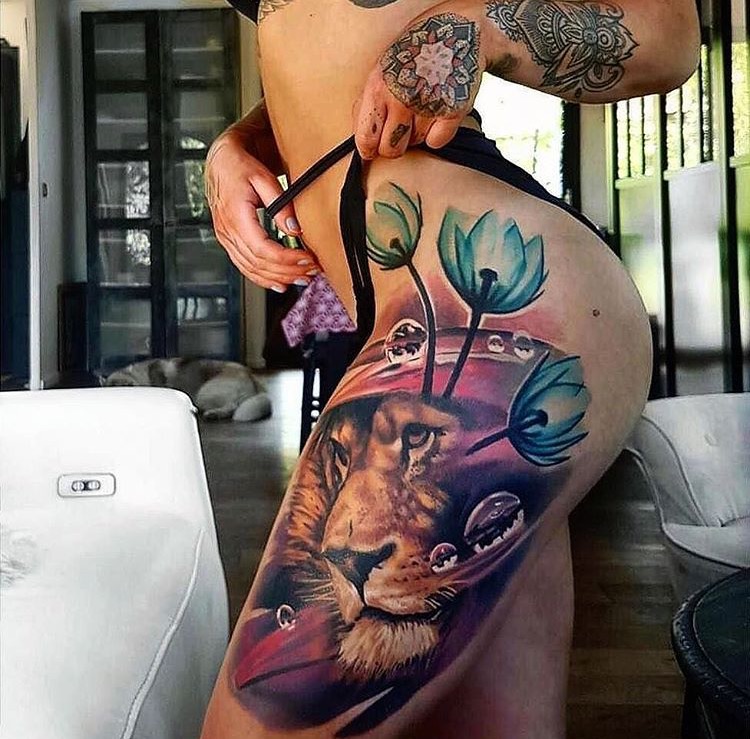 Girl with amazing lion tattoo on her thighs