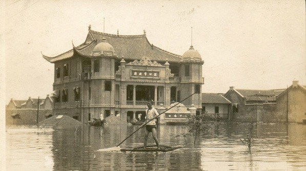 A young man uses a makeshift raft to cross the flooded street in front of Hankou City Hall in Hankou, China, in 1931. This was during the devastating Yangtze River floods that lasted for 5 months in 1931. The flooding was so bad, it is generally considered the worst natural disaster in history, as anywhere from 145,000 to 4 million people died as a result. Most experts agree more than 1 million died, but exact numbers were never counted.