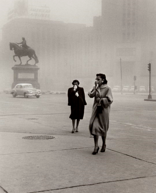 2 Women caught in a bad dust cloud that swept into Mexico City, Mexico in 1957.