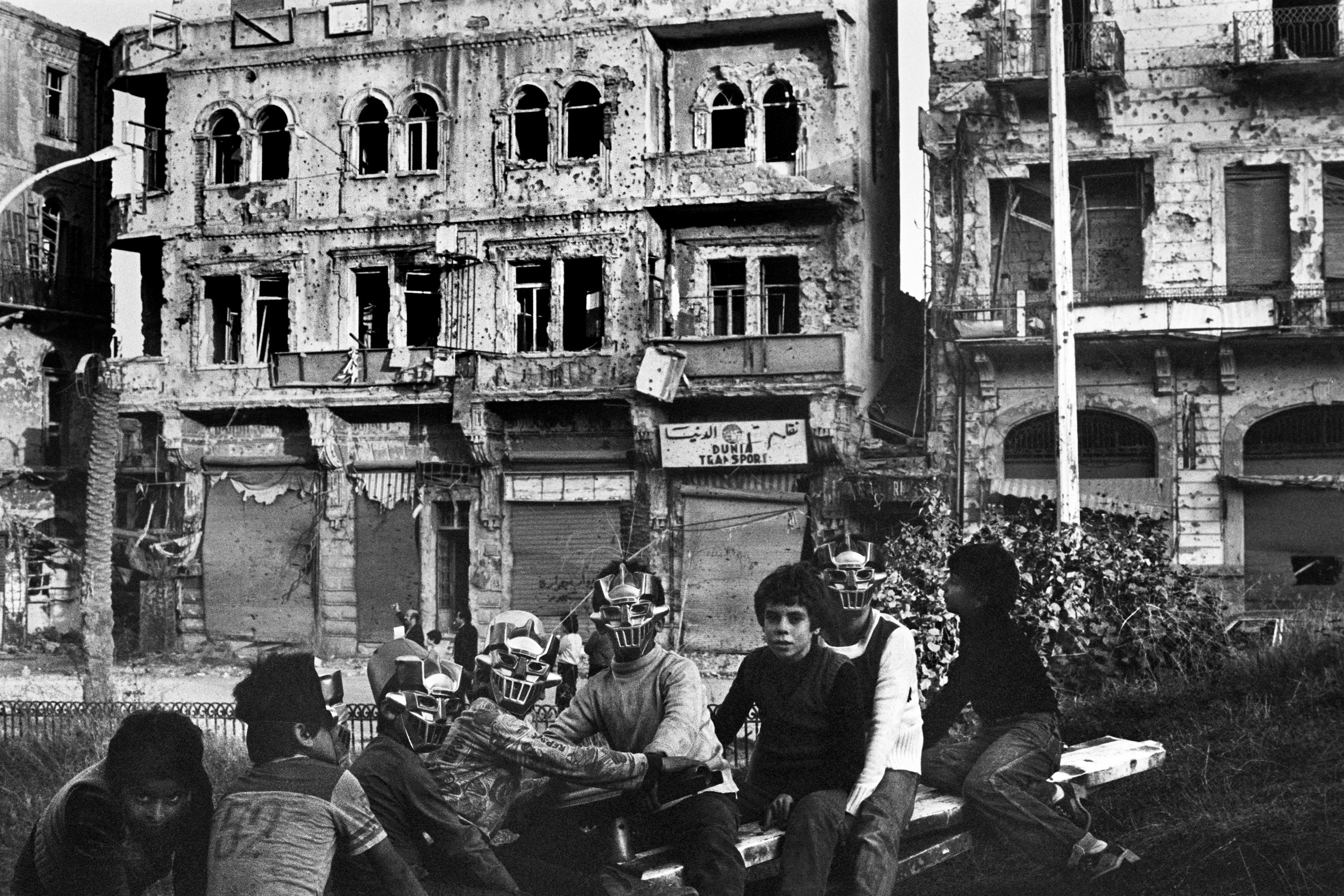 Children play as if totally oblivious to their surroundings in Beirut, Lebanon, in 1982. This area had already been damaged in the fighting in the Lebanon War, and would be center of more fighting ahead as Beirut became the focal point of most of the 3 year war.