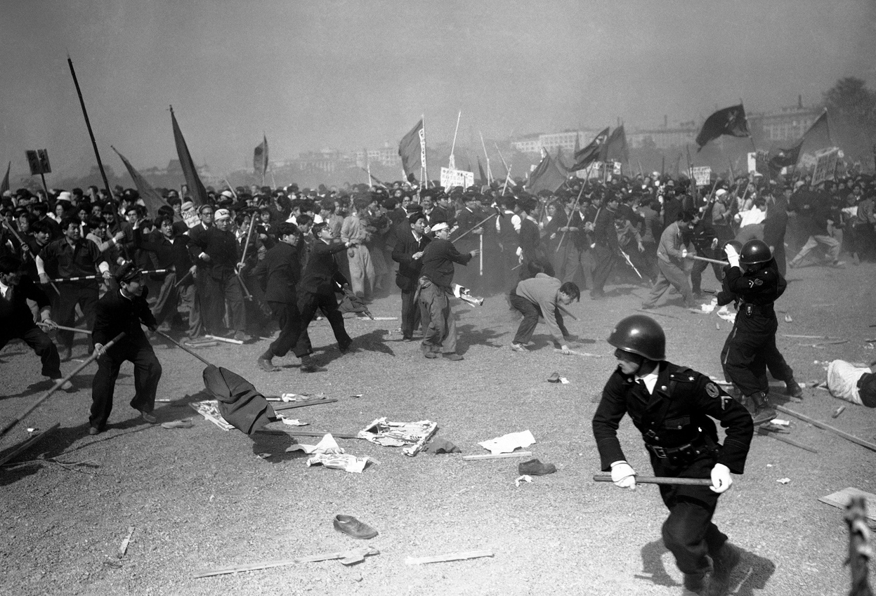 Pro-communist rioters attack police with stones during the May Day Riots in Tokyo, Japan in 1952. Near the close of the US occupation of Japan, many of the people preferred the idea of Communism and held protests which turned to riots all over Tokyo. Eventually they were put down, but not before many were killed and wounded in the fighting.