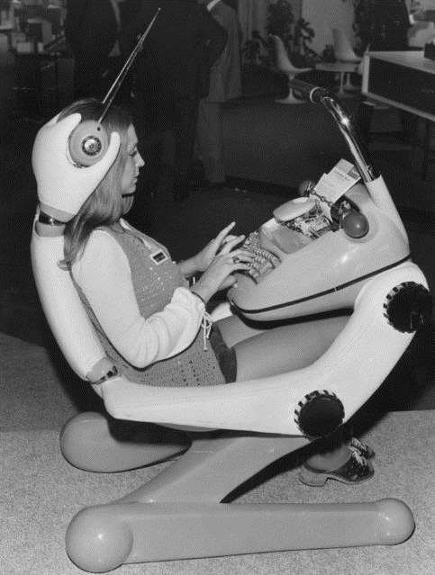 A women demonstrates a futuristic typewriter chair complete with headphones and a light in Paris, France in 1972. With the personal home computer 10 years away, these kinds of inventions became obsolete.