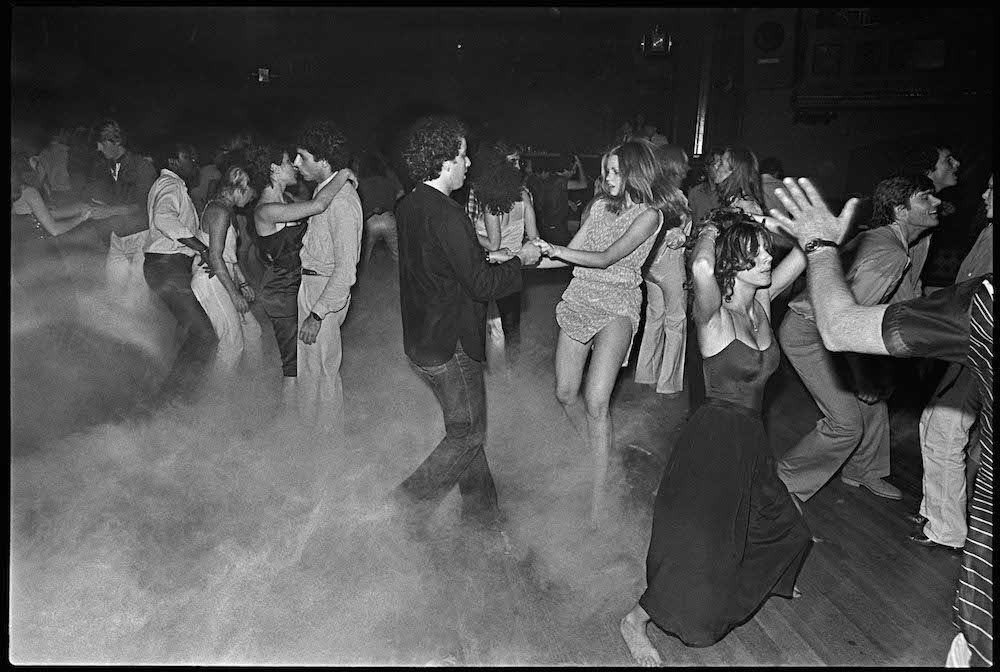 The dance floor at the famous Studio 54 in NYC, US in 1978. The fake fog was part of the effects. Many famous celebrities would party here, and the club had unique and sexy shows creating a culture that was a staple of NYC in the later 1970s through the 80s.