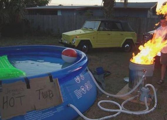 heating up the hot tub using fire in a garbage can.