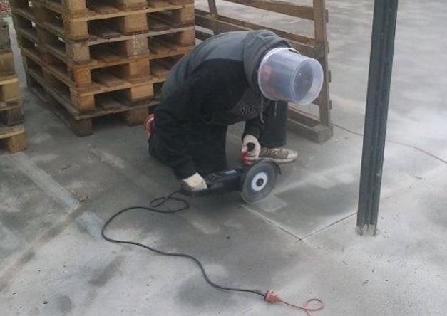 cutting with a disk while wearing plastic improvised helmet