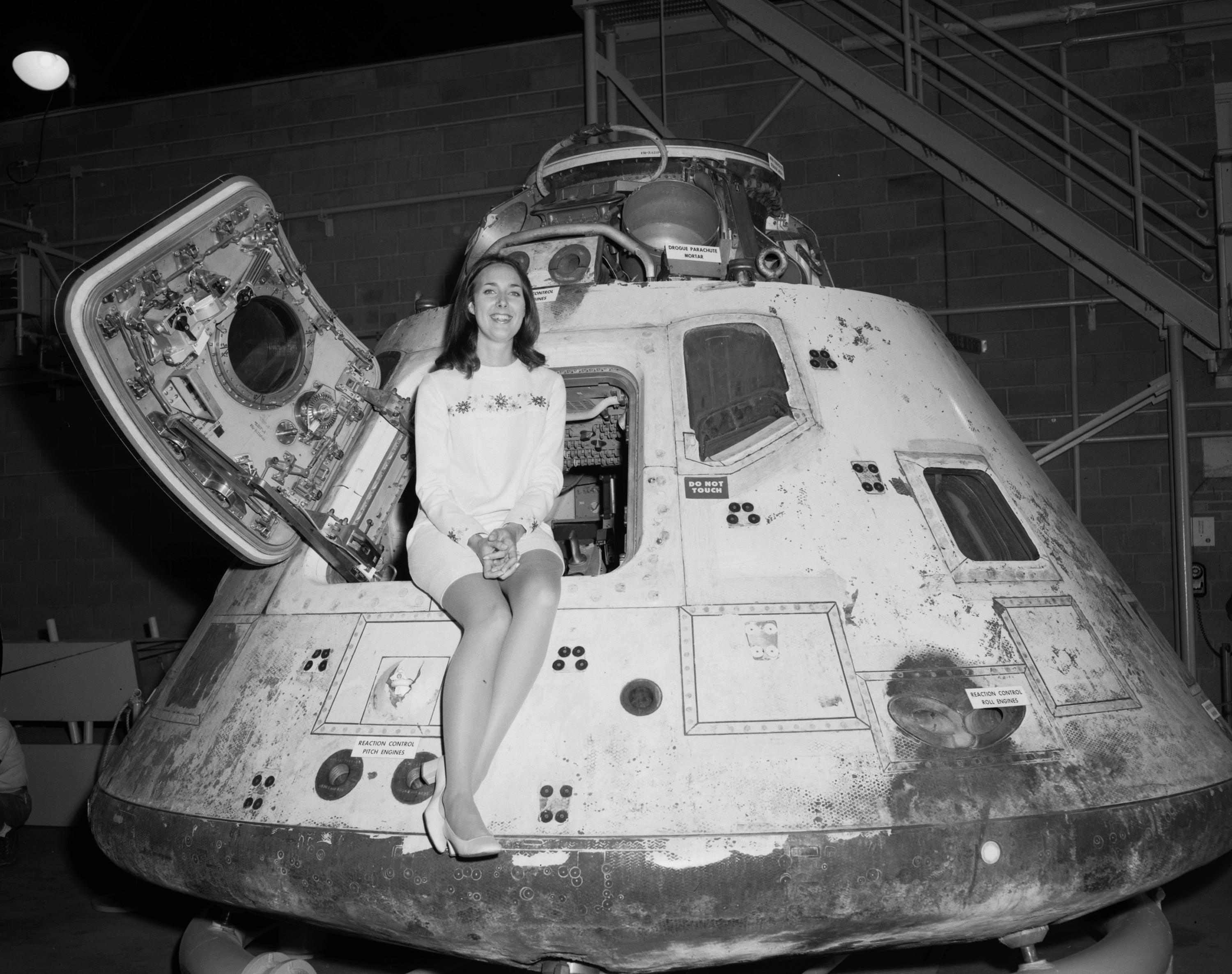 Miss NASA 1971 posing on the Apollo 8 capsule in Houston, Texas, US in 1971. Apparently NASA held a beauty pageant for many years from the 1950s until the late 1970s to try and get more people interested in the program. They originally had other titles such as Miss Guided Missile and Miss Jet Propulsion before becoming just Miss NASA in the late 1960s.