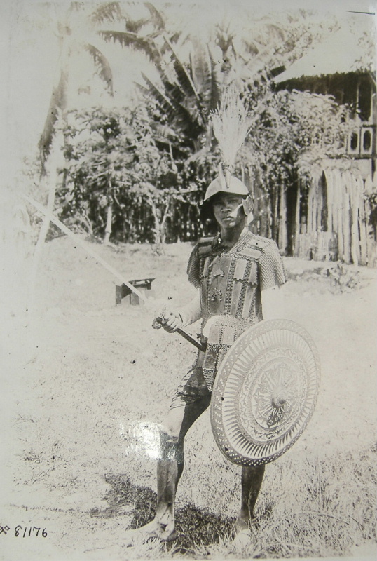 A Moro warrior stands in battle armor during the Moro Rebellion in the Philippines in 1900.