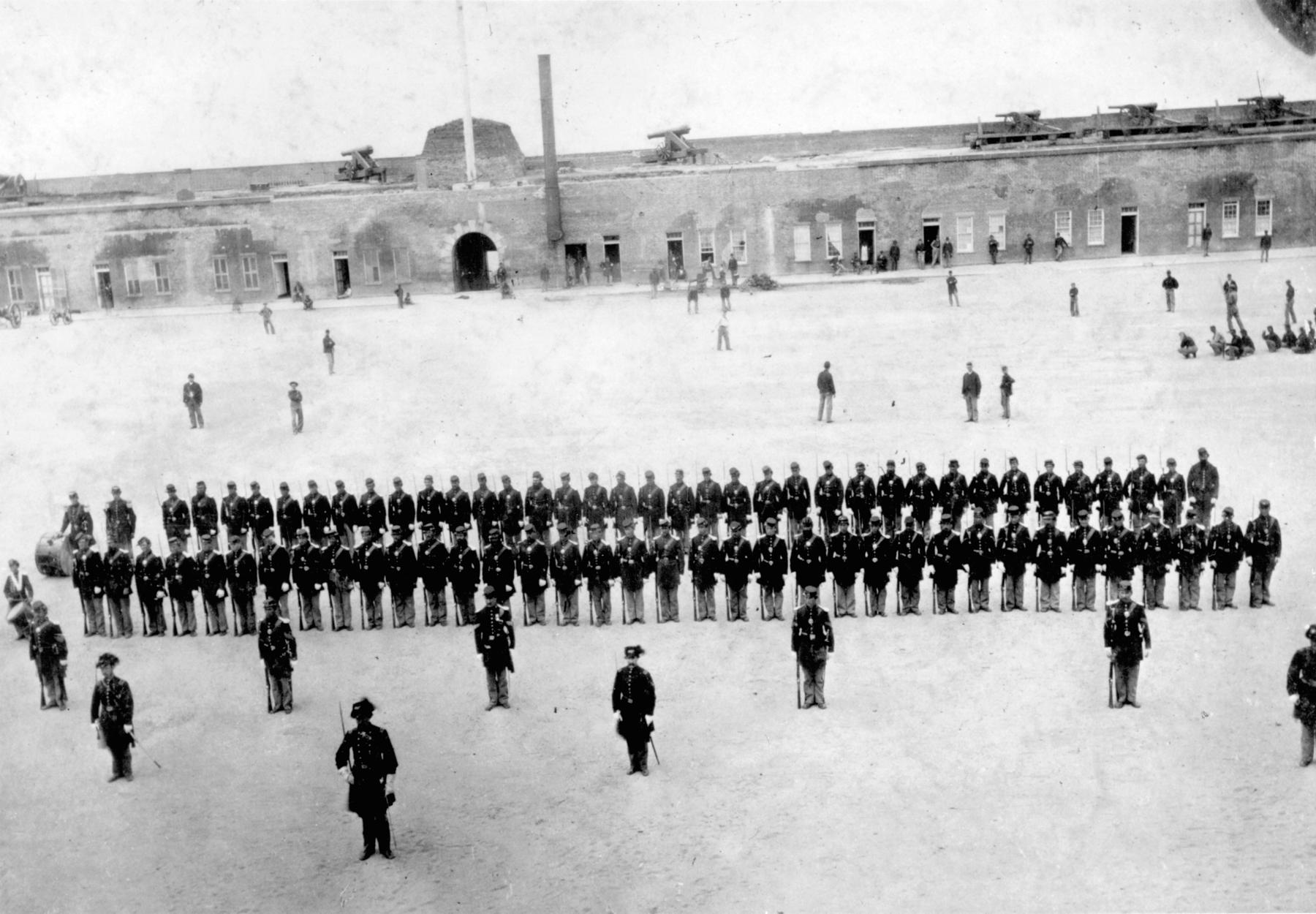 Company H of the 48th New York Regiment of the Union Army pose for a picture at Fort Pulaski, in Savannah, GA, US in 1863. If you zoom in, you can see the men in the background are actually playing baseball, and this picture is arguably the earliest known picture of a baseball game being played.