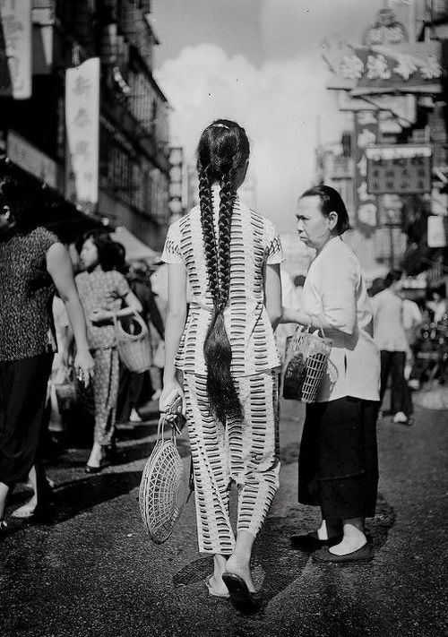 A young girl shows off a unique hair style in Hong Kong in 1958.