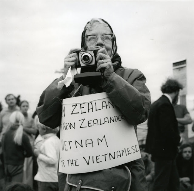 A woman holds a sign to protest the influx of Vietnamese in Wellington, New Zealand in 1984.