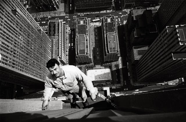 A window cleaner on the RCA Building, Rockefeller Center in NYC in 1961.