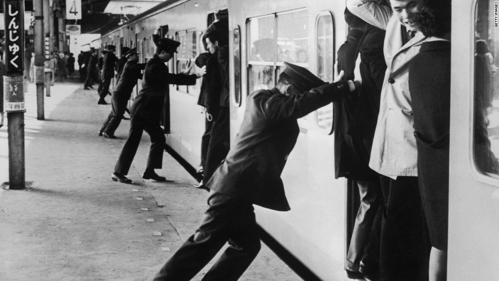 Subway Pushers try and pack as many people as possible into a subway train during rush hour in Tokyo, Japan in 1967. It hasn't gotten better since.