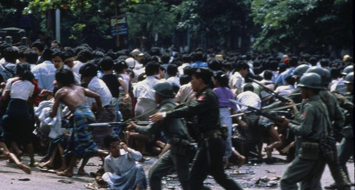 Soldiers begin to fire on protesters and charge them with bayonets to disperse them during the 8888 Uprising in Burma (now Myanmar) in 1988. The country was run by a military 1 party system at the time, and up to 2.5 million protesters turned out around the country to push for a democracy. The heavily impoverished nation, like many others at the end of the 1980s, tried to become democratic, but instead were crushed by a brutal military coup which transferred power but kept the country under military rule. An estimated 3,000 - 10,000 people were killed during this uprising, virtually all being protesters. Many more fled the country afterwards.