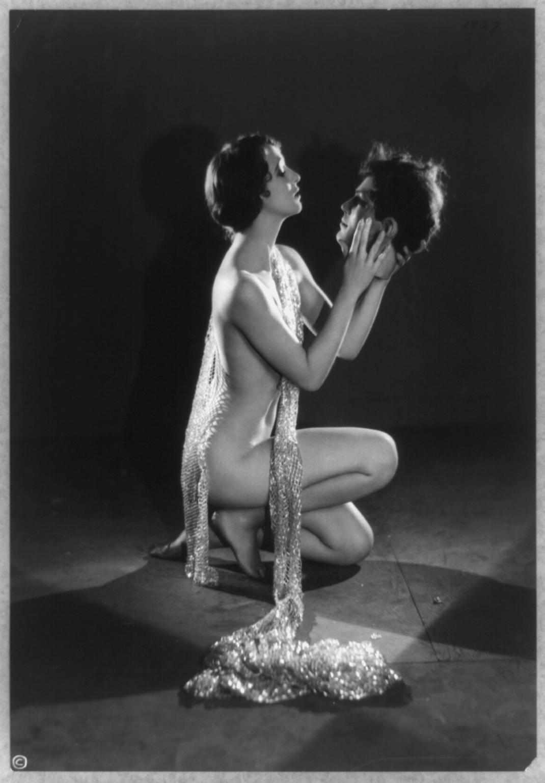 Model Kathryn Stanley holds a prop head for an artistic picture in 1926. The picture is done by Edwin Bower Hesser who helped redefine art, sex appeal, and imagination in the 1920s. Look him up, his unique grasp on photography, art, and the beauty, especially of women, was ahead of its time.