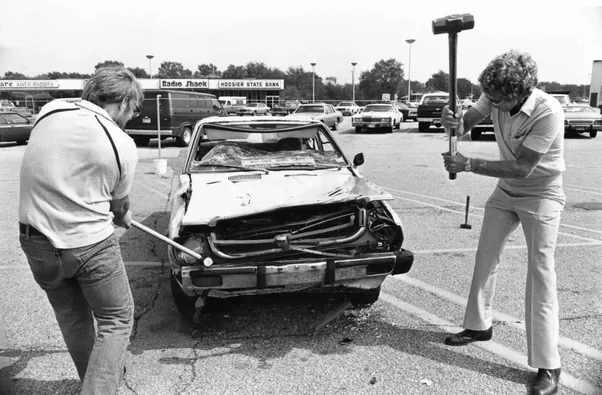 Local businessmen destroy a Japanese made car in 1988. Other American car companies suffered in the 1980s as Japanese vehicles were cheaper and more reliable. Some major US car companies even had to file for chapter 11 bankruptcy protection to avoid going under. In response, American business owners large and small made a heavy "Buy American" push in the late 1980s as the quality of Japanese goods soared. Japanese currency and international business influence also rose drastically, and this forced the American companies, especially the car companies, to improve their quality, which some did. The push however worked for many companies, and to this day many people take pride buying a sometimes inferior product, possibly even for more money, as long as it was made in America.