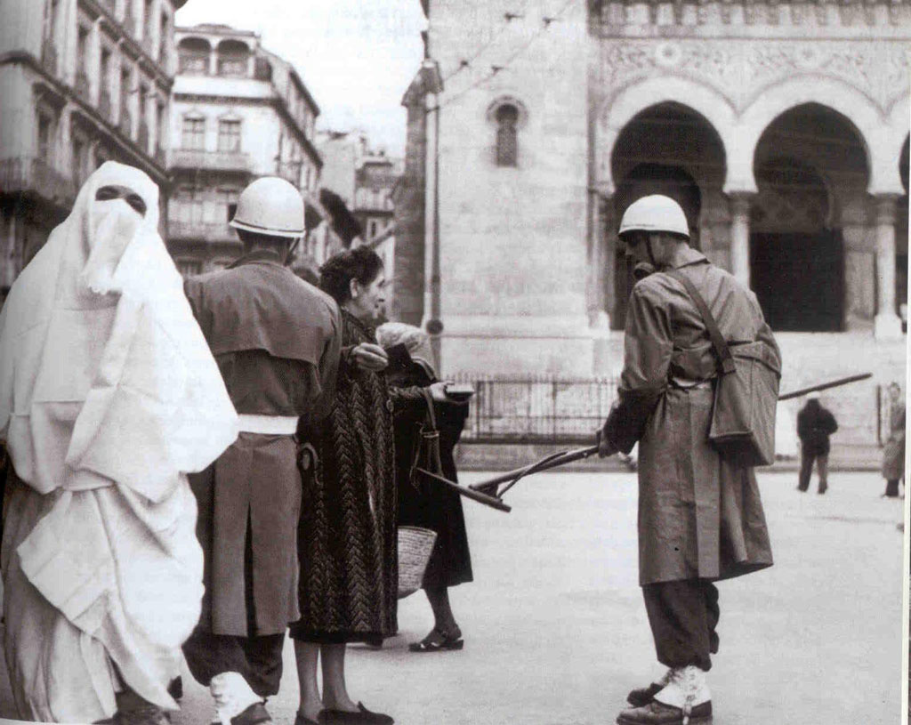 A French military policeman using a metal detector checks for weapons from civilians heading into town in Algeria in 1956. This was during the brutal Algerian War of Independence, when systematic assassinations and executions, torture, bombings, and attacks of domestic civilians on both sides dominated the fighting. Large scale battles were rare, and 1 million Europeans living in Algeria fled. This was part of the numerous countries post WWII who pushed for independence from European control. Algeria, being so close to France and having 150 years of integration already, was one of the countries France really wanted to keep. Vietnam would be another.