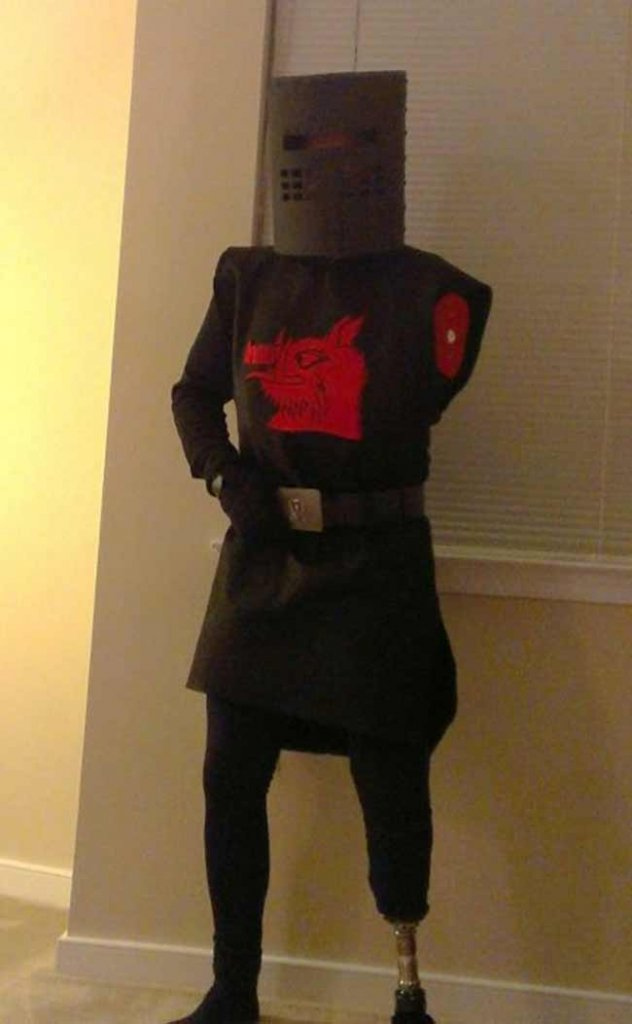 Cosplay of the guard from Monty Python by man with several limbs missing.