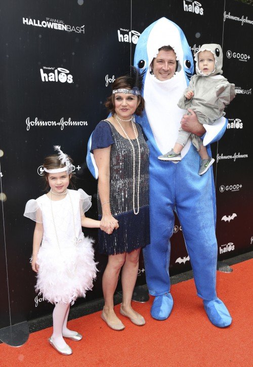 Tiffani Thiessen and her husband Brady Smith attend a Halloween party with their 2 kids in 2016. The couple have been happily married since 2005. Thiessen has had solid work in TV for her career after her breakout as Kelly Kapowski in Saved by the Bell. Acting and modeling since she was 8, she even won Miss Junior America, She used her success to get behind the scenes some, and now even owns her own production company. She also happens to be the middle sister of 3, though the other 2 are not in show business.