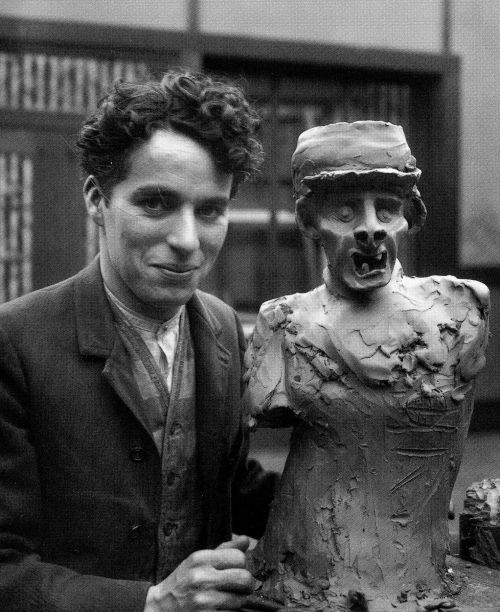 Charlie Chaplin with one of his sculptures in 1918. He made at least 2 different variations of this sculpture in his youth. Chaplin would marry 4 times, and have 11 children. He was a well known ladies man and regardless of his age always had girls around 18-25 in his life before he settled down for good with his last wife and mother of 8 of his children.