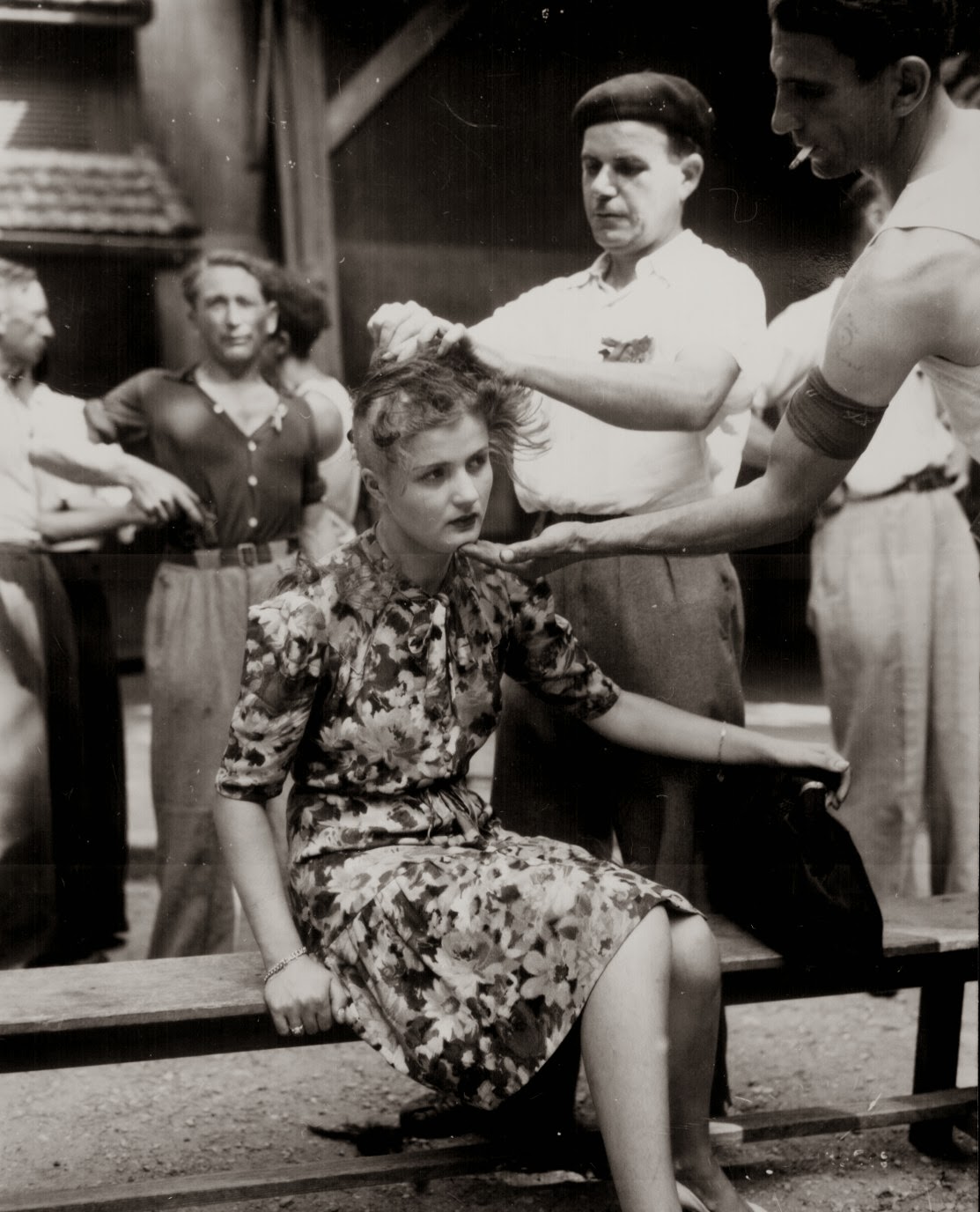 A French woman has her hair cut off in Paris, France in 1944. Once towns all across Europe were freed from Nazi occupation, many women who had any kind of relationship with Germans were humiliated, and in some cases killed. Most men who collaborated were shot. This woman, and many others, would have most likely have a Swastika drawn on her head, stripped down to undergarments, and paraded through a main street for everyone to see and know she had relations with the Germans. The women however got punished regardless of the circumstances.