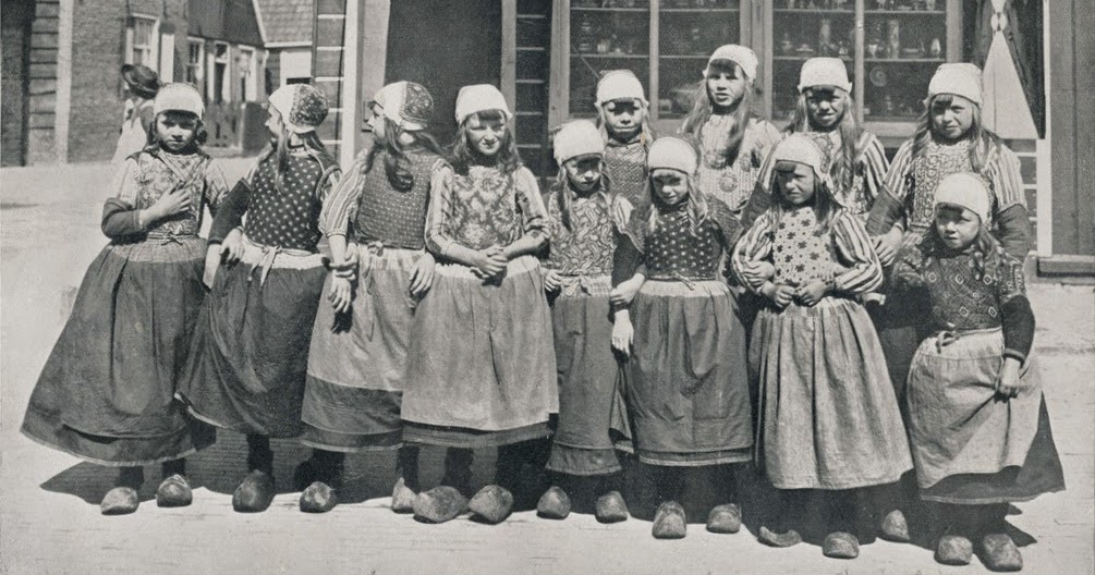 Girls wearing traditional clothes pose for a picture somewhere outside of Amsterdam in The Netherlands in 1908. Notice they all are wearing the famous Dutch wooden shoes, which was normal back then and as far back 1200 AD. Normally the shoes were not painted, like the ones shown, and each town had their own shoe maker. Sometime around 1920 did they start being painted, as colored options for items started to bloom, such as cars and clothes, and of course shoes. By the end of WWII though, they stopped being the normal footwear in The Netherlands, and eventually were phased into a novelty item.