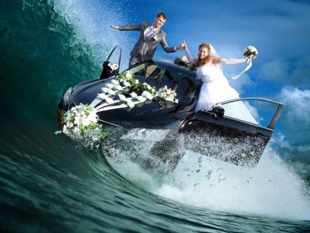 Bride and Groom surfing their car on the waves in the sea.