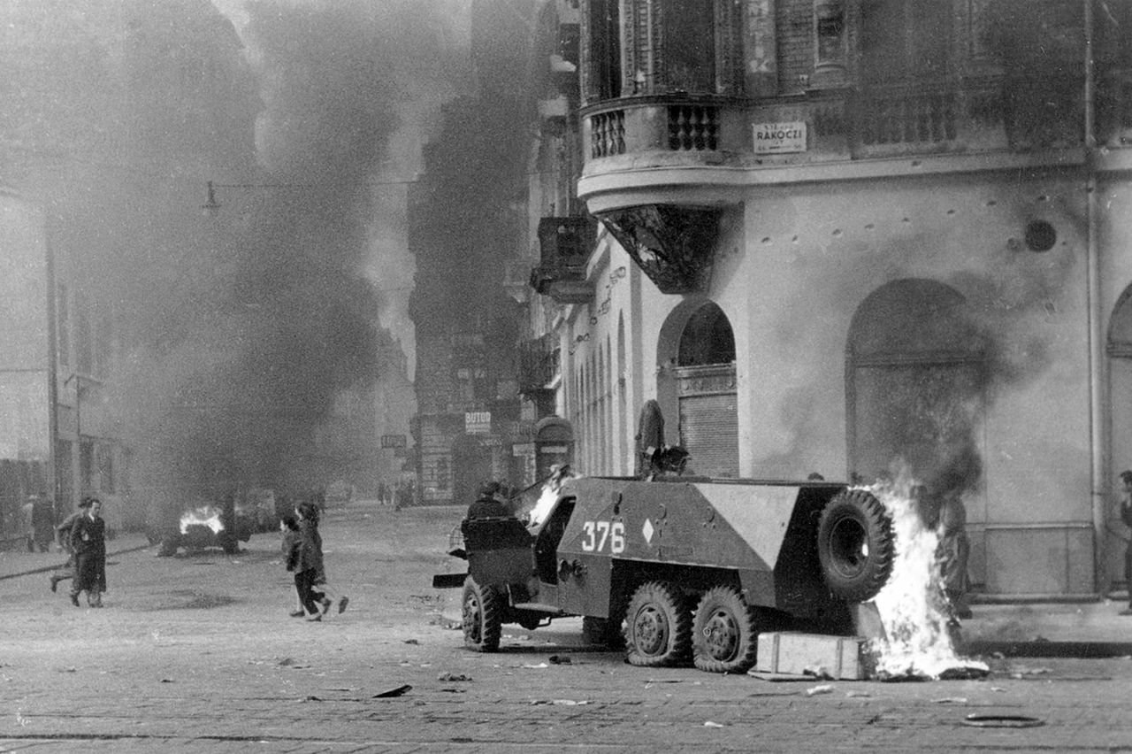 An armored soviet vehicle sits burning during the Hungarian Uprising in 1956. Soviet tanks and troops had left a week before it started, leaving a communist government in control with Soviet backing. However, the people rose up quickly, and overthrew and executed communist party members. The Soviets responded by sending back in their tanks, heavy weapons and troops and soon crushed the uprising. Like many European countries liberated by the Soviets, the Hungarian people wanted democracy, but the Soviets were firm on keeping their influence on Eastern Europe. Up to 3000 Hungarian fighters died, another 3000 civilians died, and up to 13,000 people were wounded during the uprising. The Soviets lost 722 soldiers, with around 1500 wounded.