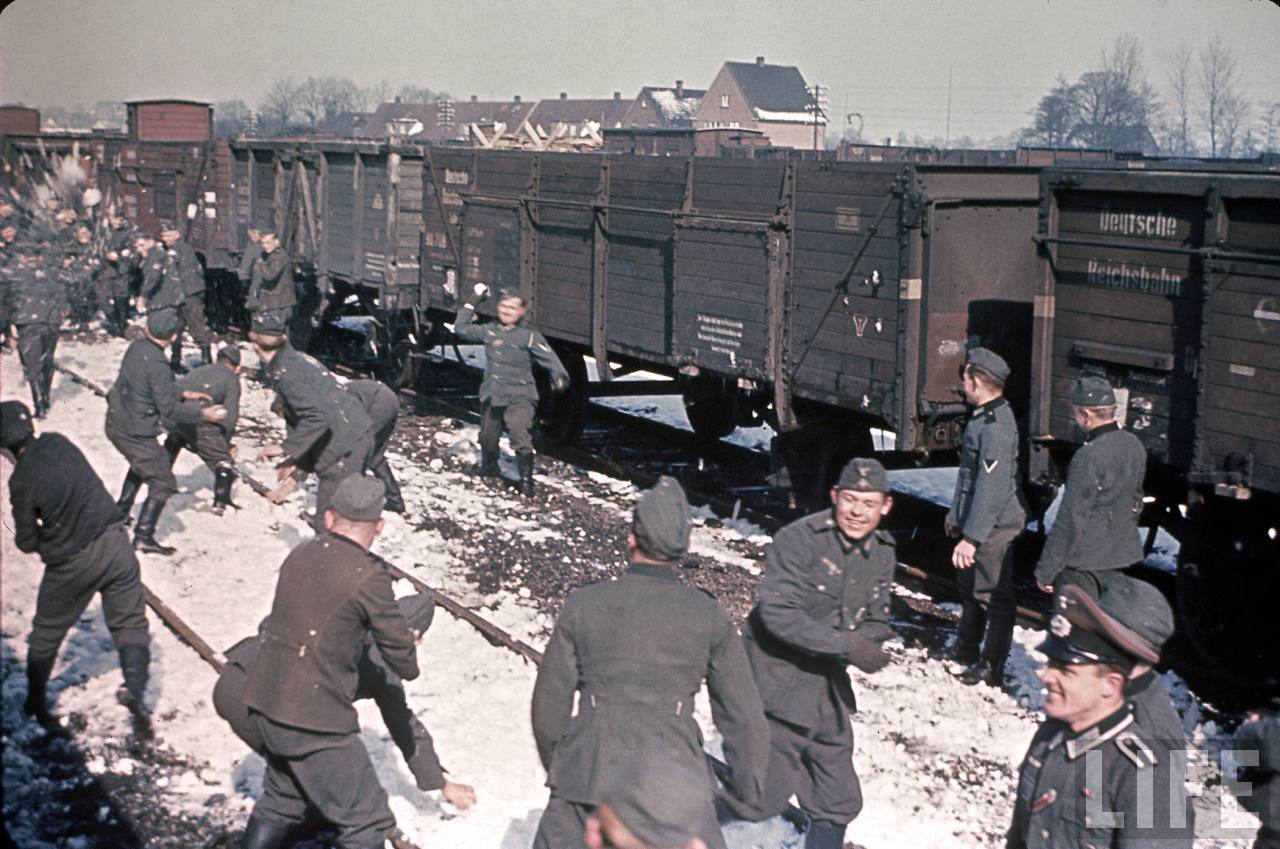 German (Nazi) soldiers have an all out snowball fight while waiting deployment in France in 1942.