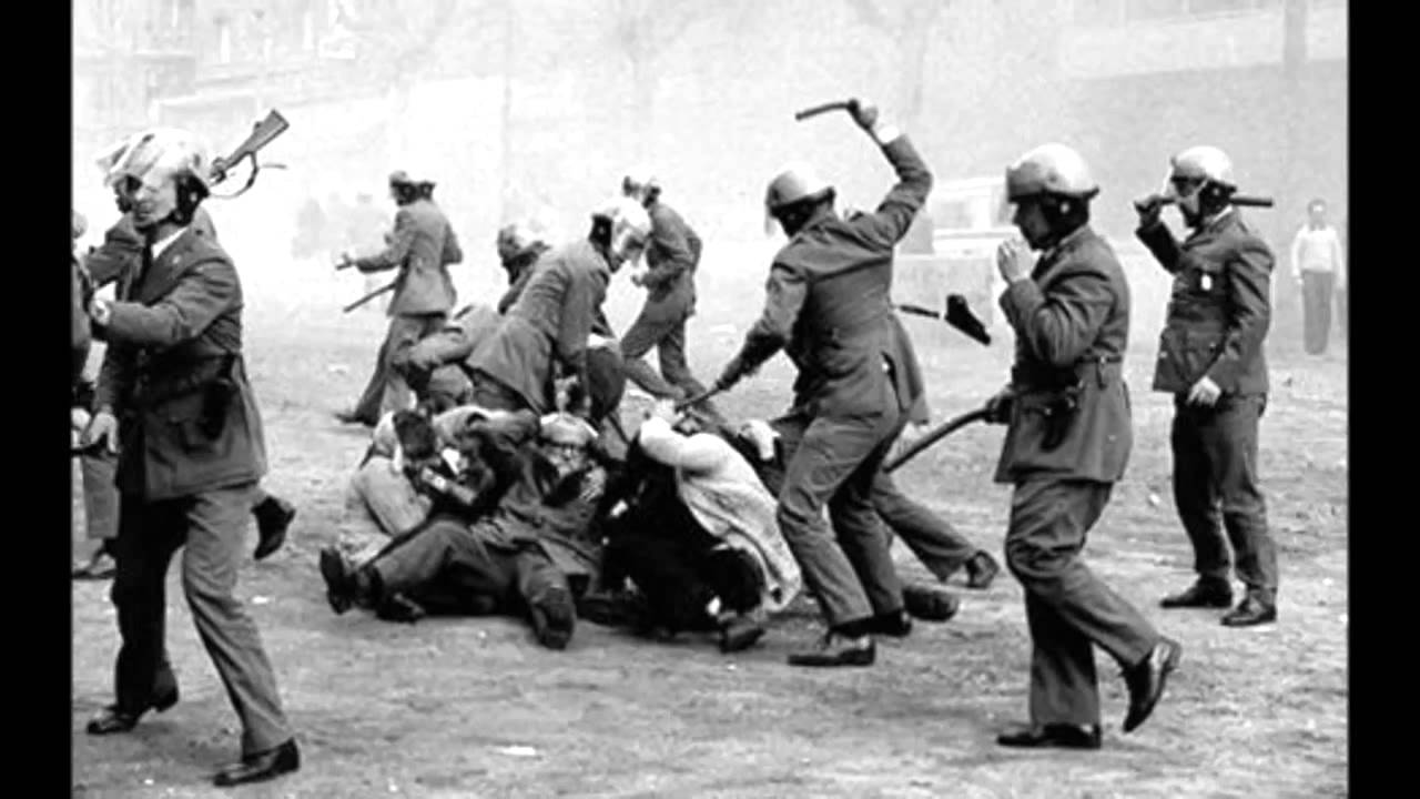 Mexican police beat civilians during the Tlatelolco Massacre in Mexico City, Mexico in 1968. Large groups of people gathered and began protesting after the Mexican government spent $150 million on the upcoming Olympic Games in 1968 (equivalent to $1 Billion today). This unnecessary spending on an event instead of on the people who had major needs caused significant backlash against Mexican president Gustavo Díaz Ordaz. When some 10,000 people gathered in the Plaza de las Tres Culturas in the Tlatelolco section of Mexico City, the police and army moved in to remove them. They opened fire and killed up to 400 people, many of whom were workers and students, and arrested another 1,300. The official death toll was 44, and the government claimed the civilians were armed and had snipers fire on the soldiers. Around the year 2000, it came out there were indeed snipers, however they were employed by the government and used to cover their soldiers. However, they instead used them as a faint assault to justify force against the protesters. This all happened 10 days before the Olympic Games opened in Mexico City, and few nations even spoke out against the massacre.