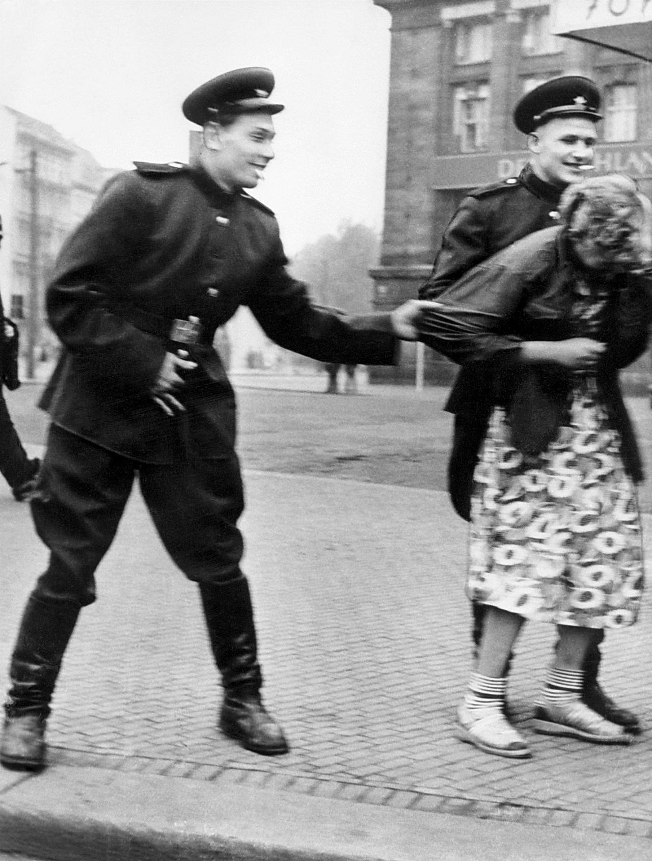 Russian soldiers harass a German girl in Berlin, Germany in 1946. For almost 3 years after the war, it was estimated up to 2 million German women were raped by Russian soldiers. A number of women and children were also killed for no reason during the final stages of the war and even afterwards. The occupying Russian Army had almost a blank check to do what they wanted to the German people once they occupied East Germany. Finally, the Russian higher ups took control of the situation, and even severely punished rapist by 1950.