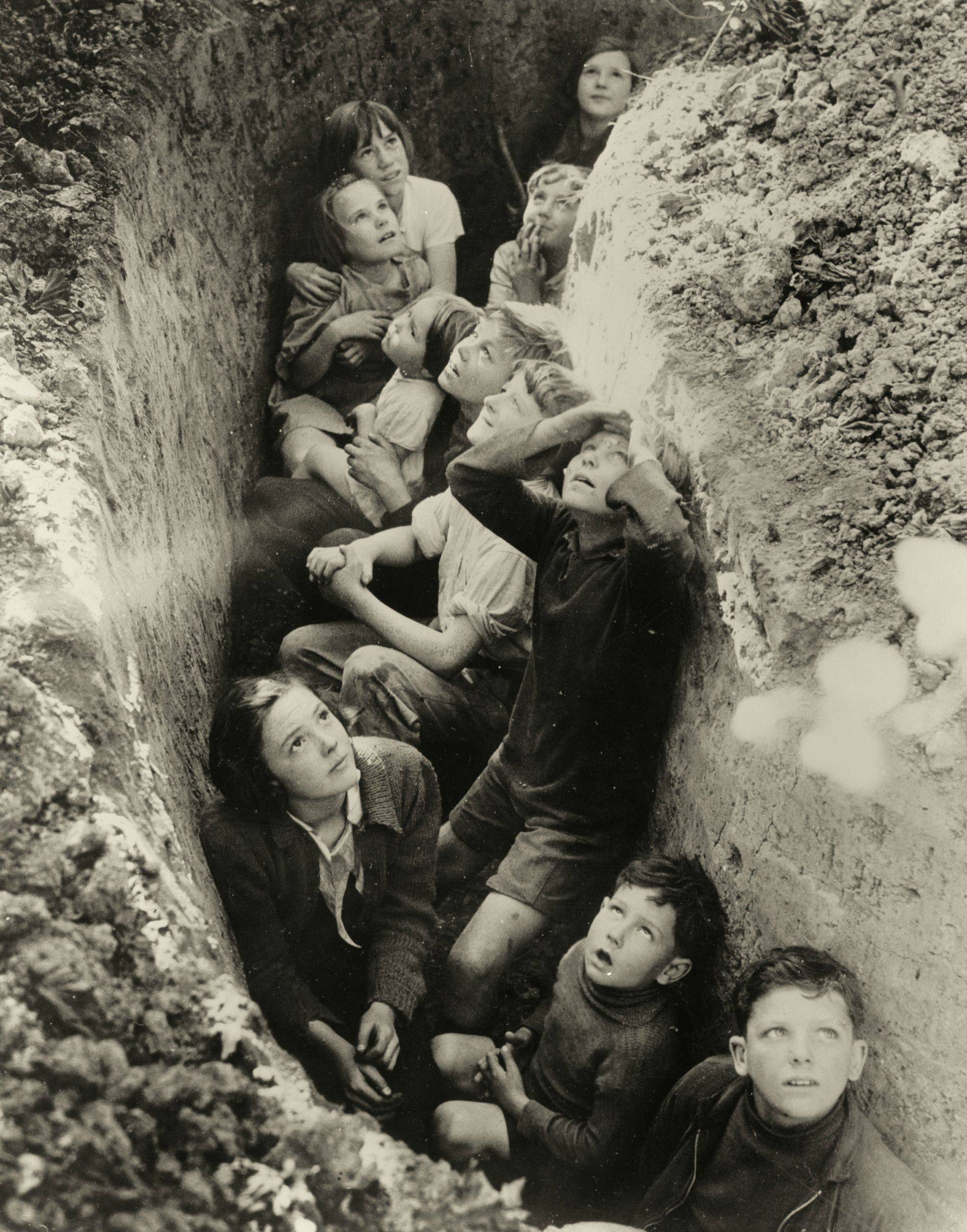 Children take cover in a makeshift bomb shelter during a German air raid over London, England in 1941. The Blitz as it was known lasted a year, and at times the Germans bombed London almost every day and night for months at a time. Around 43,000 civilians died during the bombings, with another 135,000 wounded.