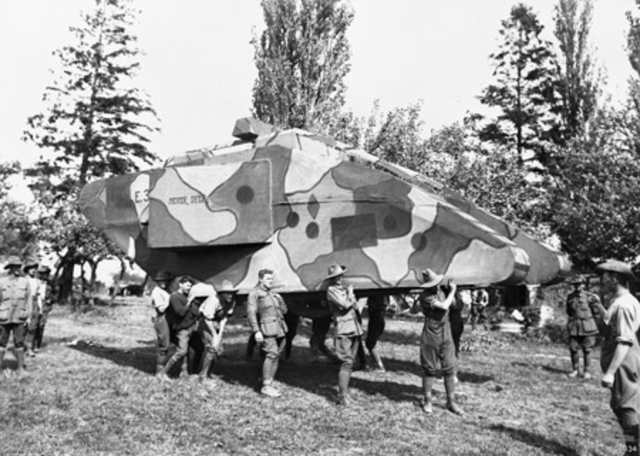 Australian troops move a fake tank during WWI in 1917. Fake weapons is an old trick. For example, there were some fake canons surrounding Washington DC in the civil war to deceive the Army of Virginia's scouts into thinking it was impenetrable when they invaded the North. As aerial photography began, fake weapons and vehicles were heavily used in WWI and WWII. In fact, troops trained to knock out certain bunkers and artillery pieces in the Invasion of Normandy would get there only to find it was fake. This also happened often in the Pacific with Japanese using fake artillery pieces to give off stronger defenses on certain islands.