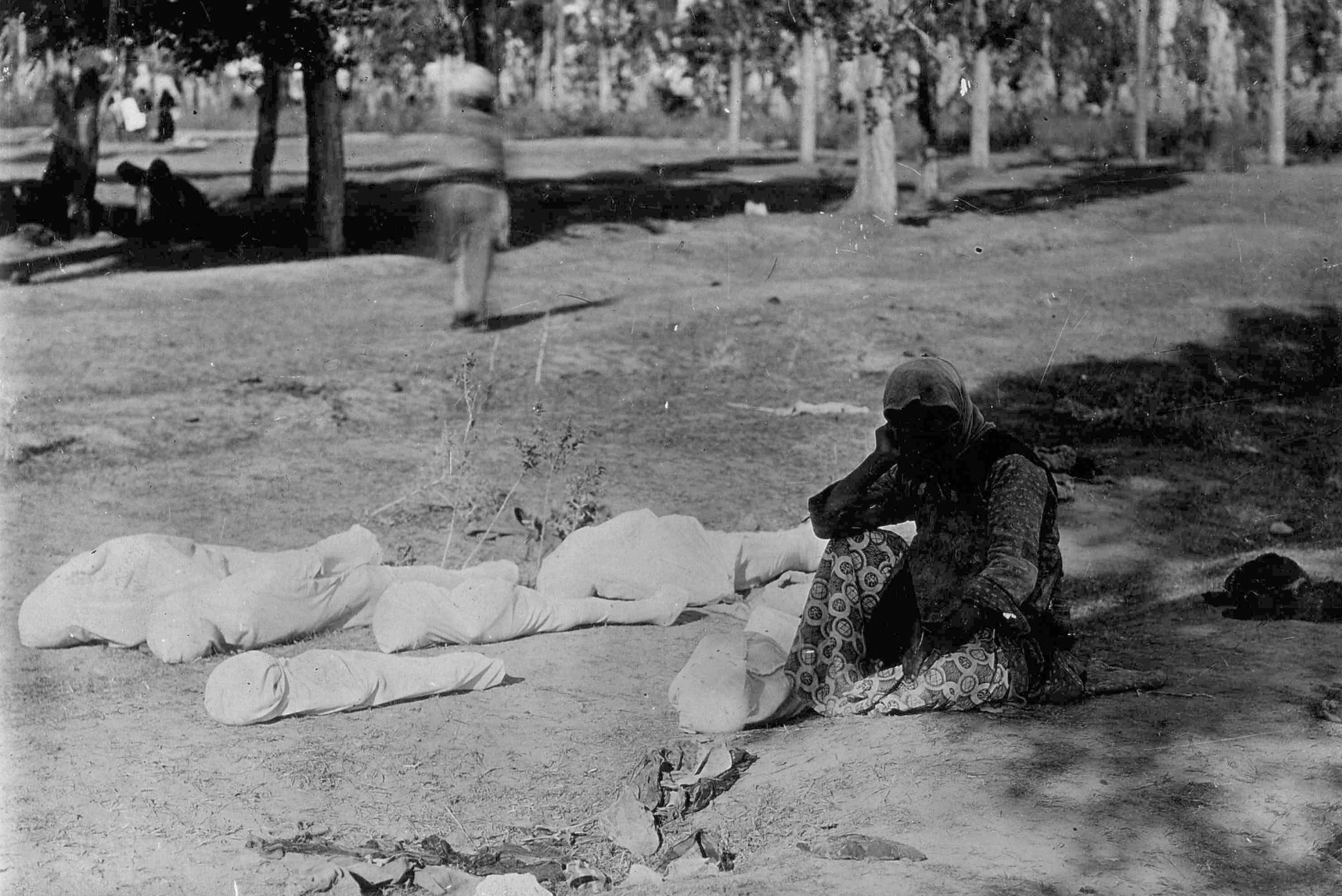 An Armenian mother sits besides the bodies of her 6 children in 1915. They had been separated from their mom and starved to death during the Armenian Genocide. The fate of the mother is unknown. The father may have already been killed. The Ottoman Turks are believed to have killed 1.5 million Armenians in an ethnic cleansing of the area. They executed many, but preferred to starve the Armenians, often separating families and sometimes using the adults into forced labor while the old, sick, and children starved. Eventually they would kill everyone who were no longer useful. Many fled to Syria and would die on the harsh roads. Turkey to this day does not acknowledge the genocide.